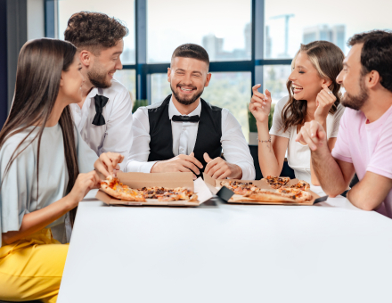 Arrise employees enjoying pizza