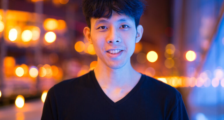 portrait-asian-man-smiling-outdoors-night-780x420